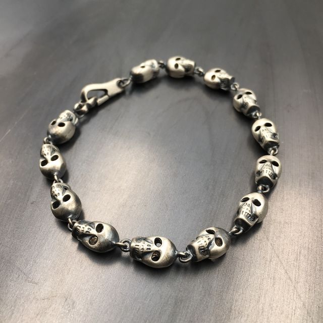bracciale in argento 925‰ con teschi tridimensionali
