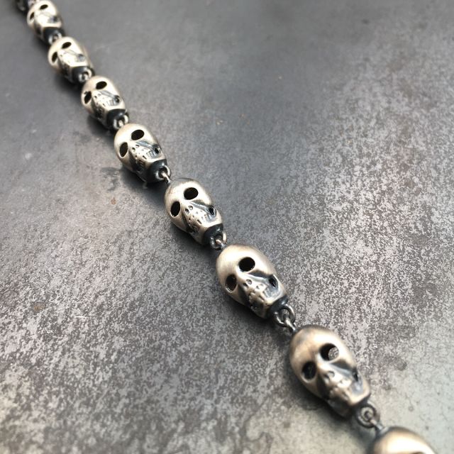 bracciale in argento 925‰ con teschi tridimensionali