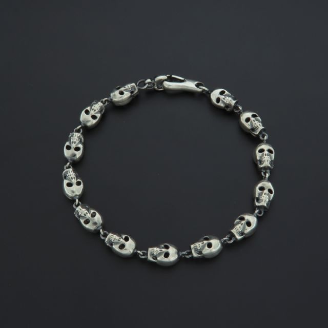bracciale in argento 925‰ con teschi tridimensionali